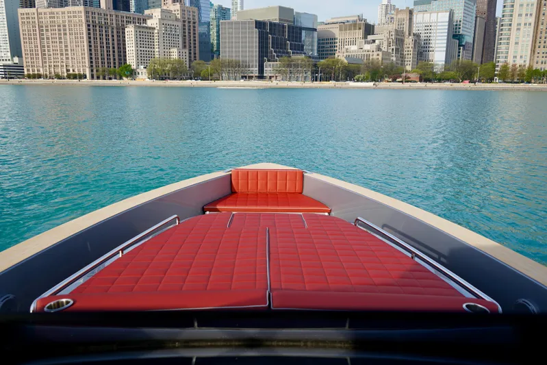  Yacht Photos Pics 2025 Pardo Yachts 43 with red seating, city skyline in background.