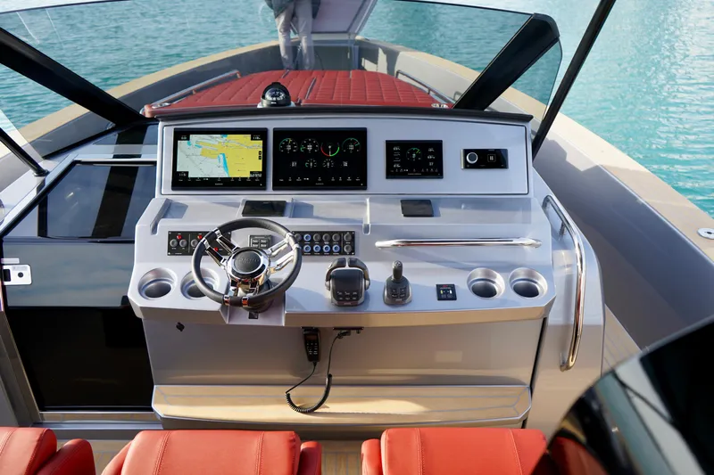  Yacht Photos Pics Helm of 2025 Pardo Yachts 43 with modern navigation displays and red seating.