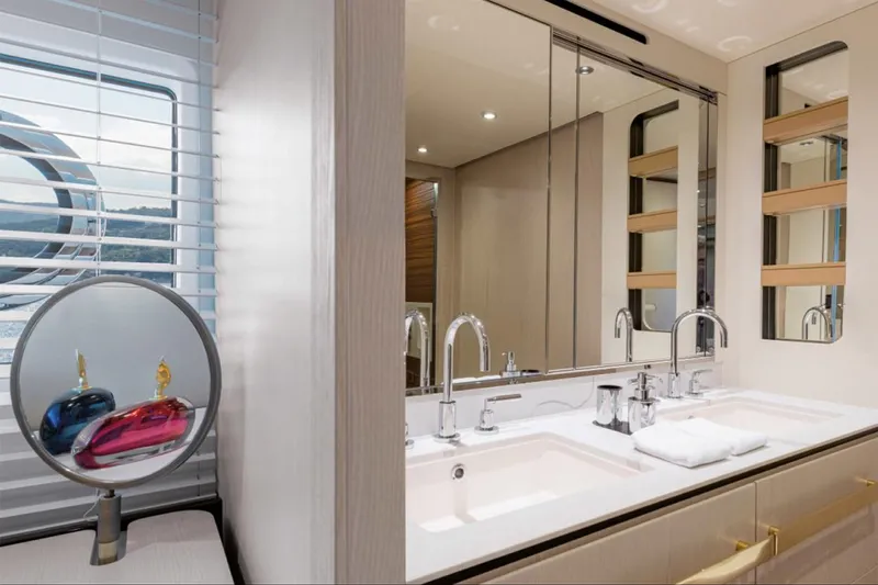 Dejavu Yacht Photos Pics Luxurious bathroom interior of 2020 Azimut 78 yacht with dual sinks and elegant decor.