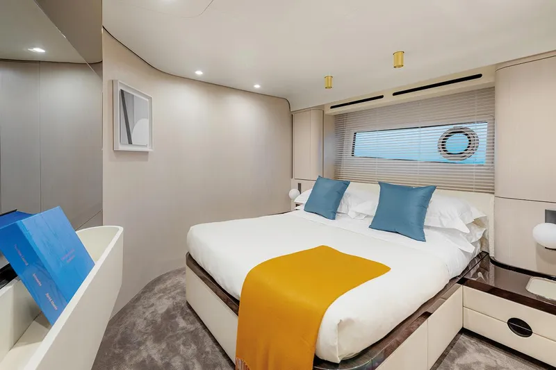 Dejavu Yacht Photos Pics Luxurious bedroom interior of 2020 Azimut 78 yacht with modern decor and cozy bedding.