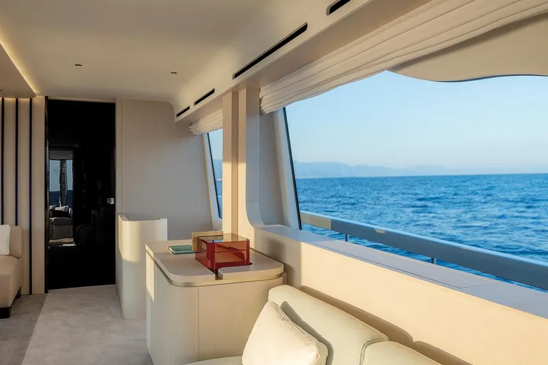 Dejavu Yacht Photos Pics Luxurious interior of 2020 Azimut 78 yacht with ocean view through large windows.
