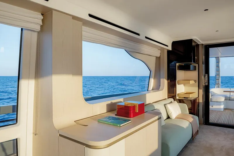 Dejavu Yacht Photos Pics Luxurious interior of 2020 Azimut 78 yacht with ocean view through large windows.