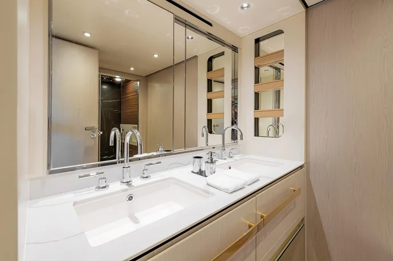 Dejavu Yacht Photos Pics Luxurious bathroom in 2020 Azimut 78 yacht with dual sinks and elegant fixtures.