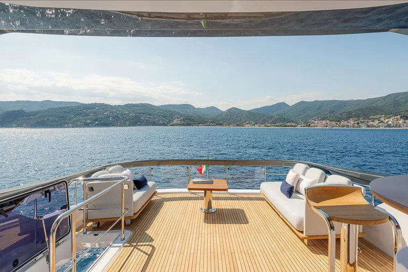 Dejavu Yacht Photos Pics Luxurious 2020 Azimut 78 yacht deck with stunning sea and mountain views.