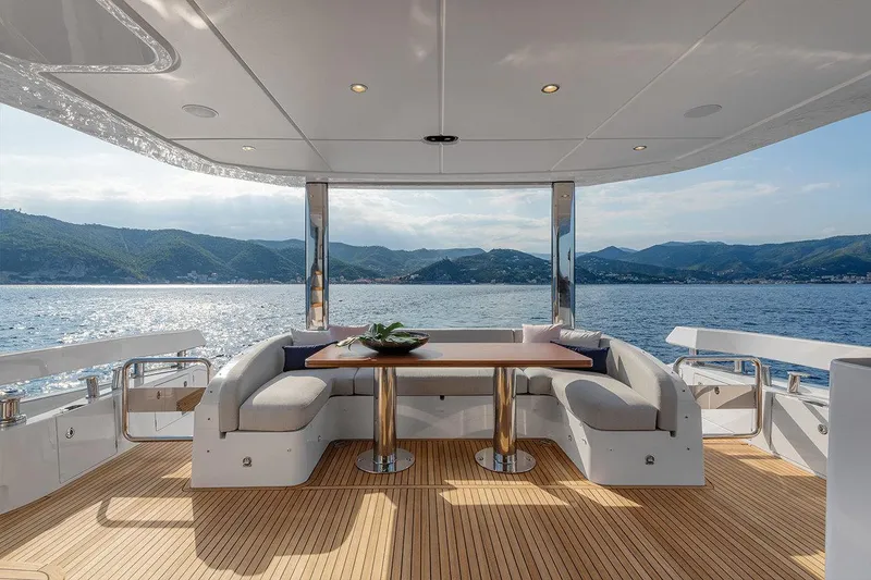 Dejavu Yacht Photos Pics Luxurious 2020 Azimut 78 yacht deck with elegant seating and stunning ocean view.