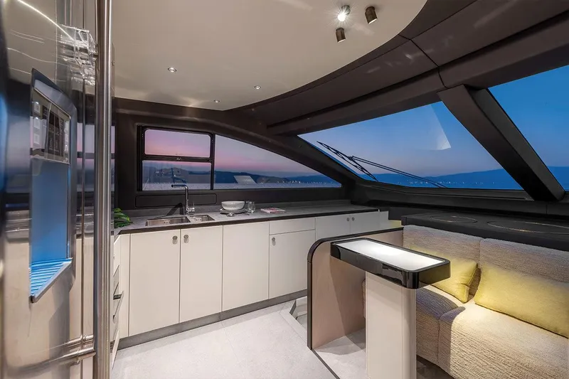 Dejavu Yacht Photos Pics Luxurious interior of 2020 Azimut 78 yacht with modern kitchen and ocean view.