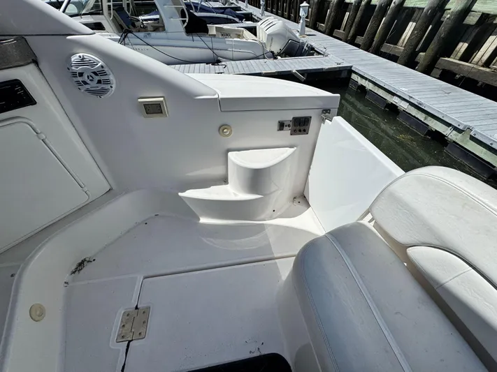 Out With The Buoys II Yacht Photos Pics 2009 Regal Commodore 4060 boat interior, featuring seating and dockside view.