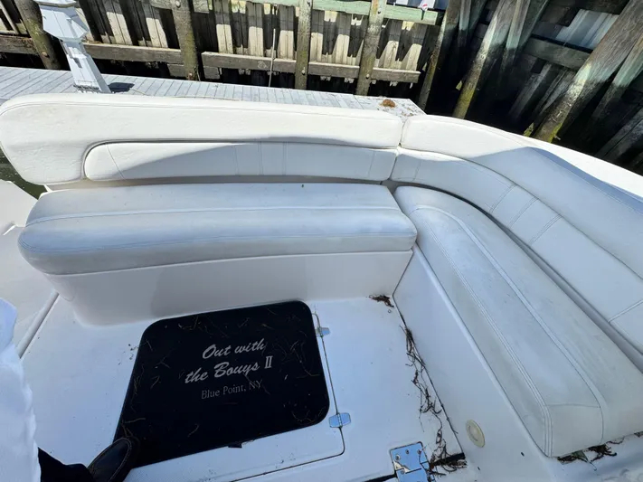 Out With The Buoys II Yacht Photos Pics 2009 Regal Commodore 4060 boat with white seating and dock background.