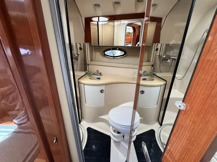 Out With The Buoys II Yacht Photos Pics Luxurious bathroom in 2009 Regal Commodore 4060 yacht with dual sinks and modern fixtures.