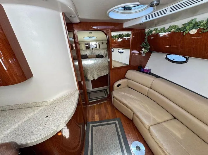 Out With The Buoys II Yacht Photos Pics Luxurious 2009 Regal Commodore 4060 yacht interior with leather seating and elegant wood finishes.
