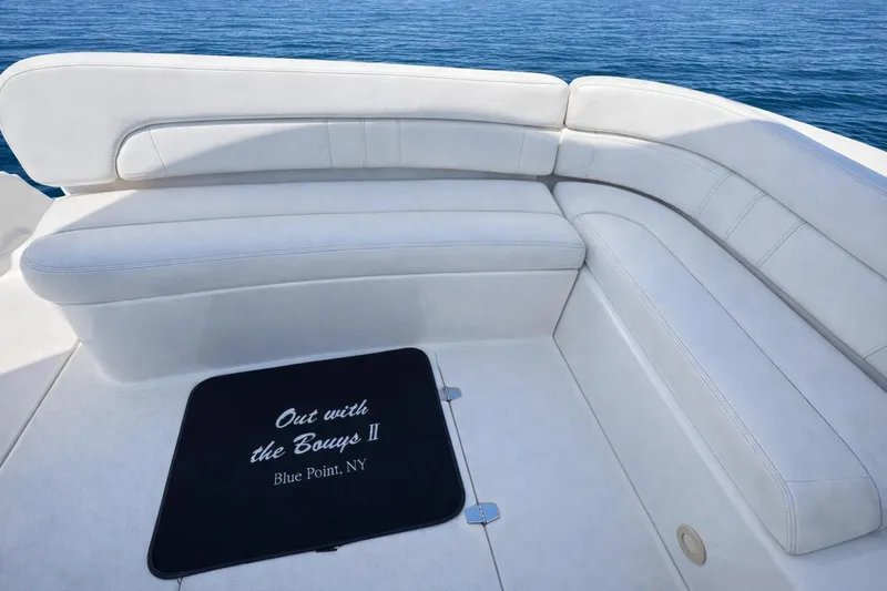 Out With The Buoys II Yacht Photos Pics 2009 Regal Commodore 4060 boat seating area with custom mat, ocean view.