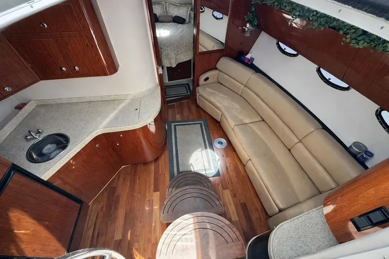 Out With The Buoys II Yacht Photos Pics Luxurious interior of 2009 Regal Commodore 4060 yacht with leather seating and wood finish.