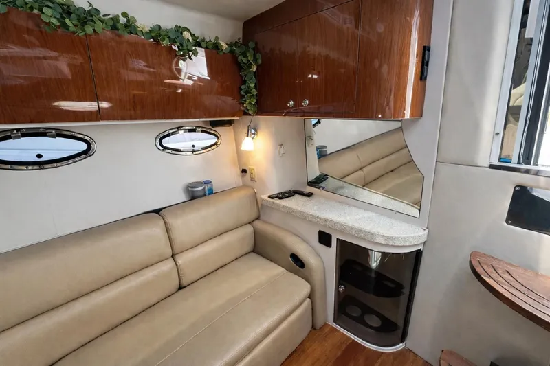 Out With The Buoys II Yacht Photos Pics Luxurious interior of 2009 Regal Commodore 4060 yacht with leather seating and wood accents.