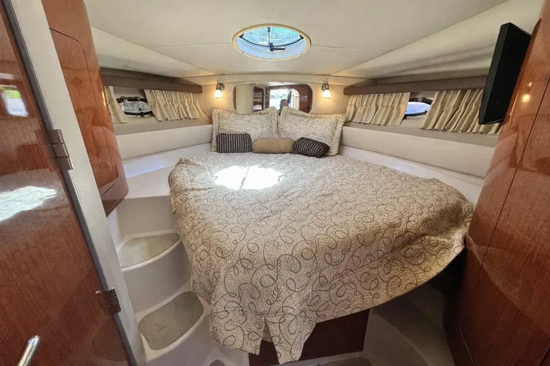 Out With The Buoys II Yacht Photos Pics Luxurious cabin interior of 2009 Regal Commodore 4060 yacht with cozy bedding.