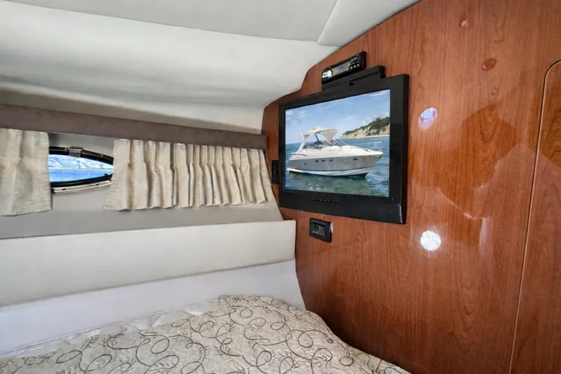 Out With The Buoys II Yacht Photos Pics Interior of 2009 Regal Commodore 4060 yacht with TV and window view.
