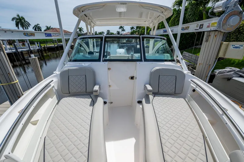  Yacht Photos Pics 2022 Pursuit DC 246 Dual Console boat with spacious seating and sleek design.