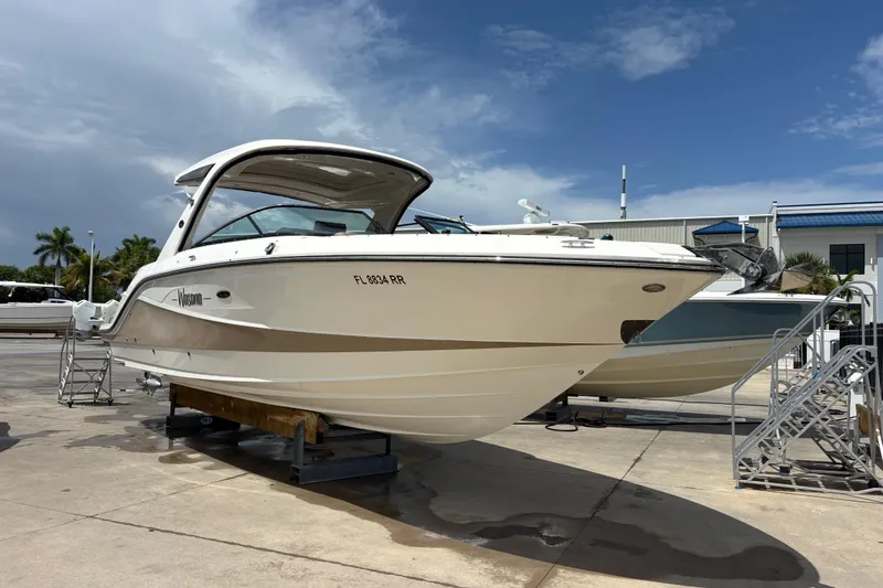  Yacht Photos Pics 2018 Sea Ray SLX 310 Outboard boat on display at a marina under a clear sky.