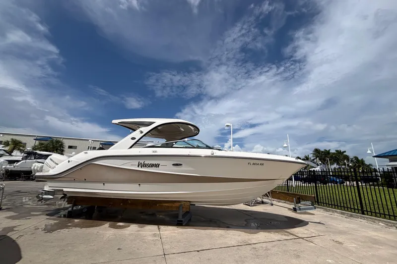 Yacht Photos Pics 2018 Sea Ray SLX 310 Outboard boat on display under a clear blue sky.