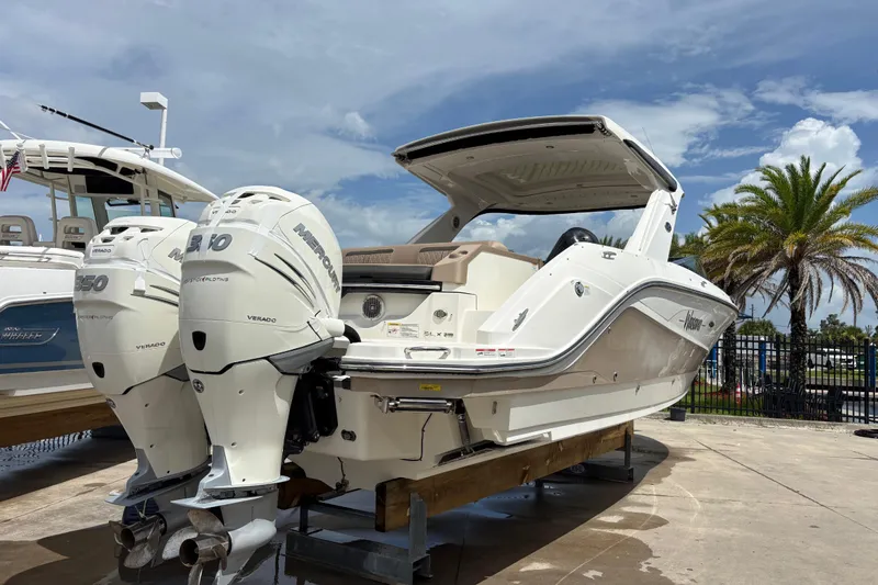  Yacht Photos Pics 2018 Sea Ray SLX 310 Outboard boat with twin Mercury engines on display.