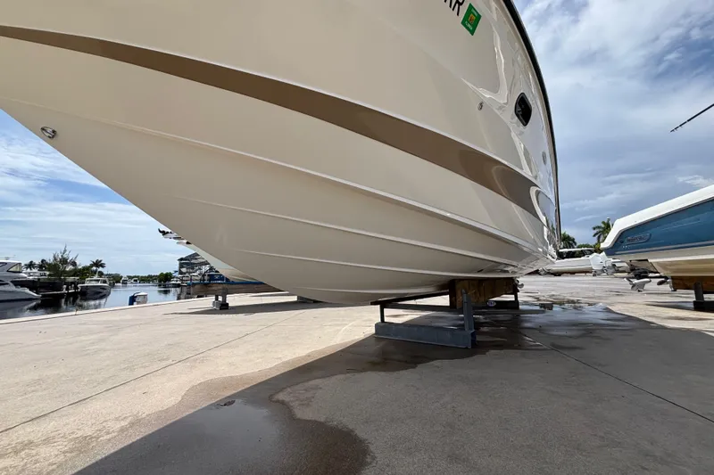  Yacht Photos Pics 2018 Sea Ray SLX 310 Outboard boat on dry dock, marina background.