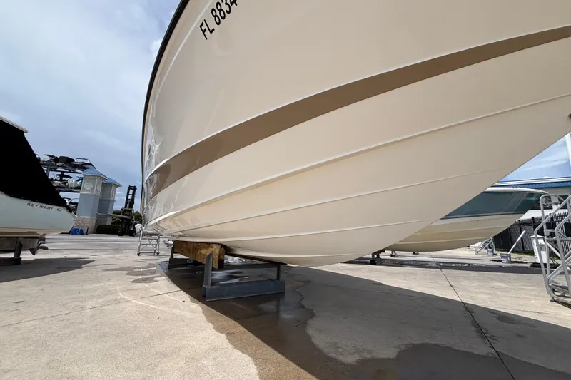  Yacht Photos Pics 2018 Sea Ray SLX 310 Outboard boat on dry dock, showcasing hull design.
