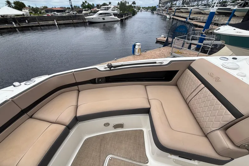  Yacht Photos Pics 2018 Sea Ray SLX 310 Outboard boat with luxurious seating at a marina.