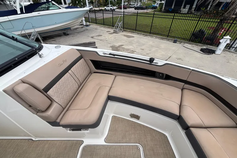  Yacht Photos Pics 2018 Sea Ray SLX 310 Outboard boat with beige seating and spacious deck area.