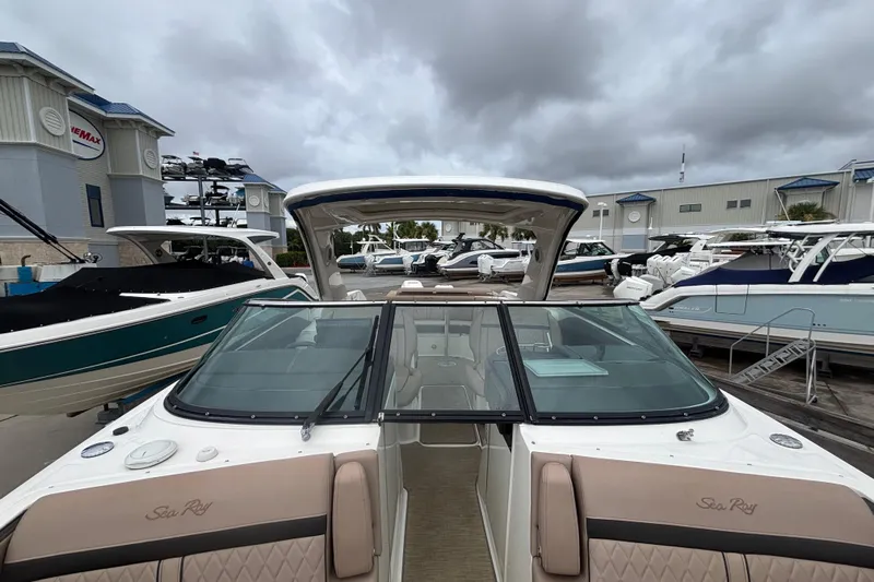  Yacht Photos Pics 2018 Sea Ray SLX 310 Outboard boat at marina, cloudy sky background.