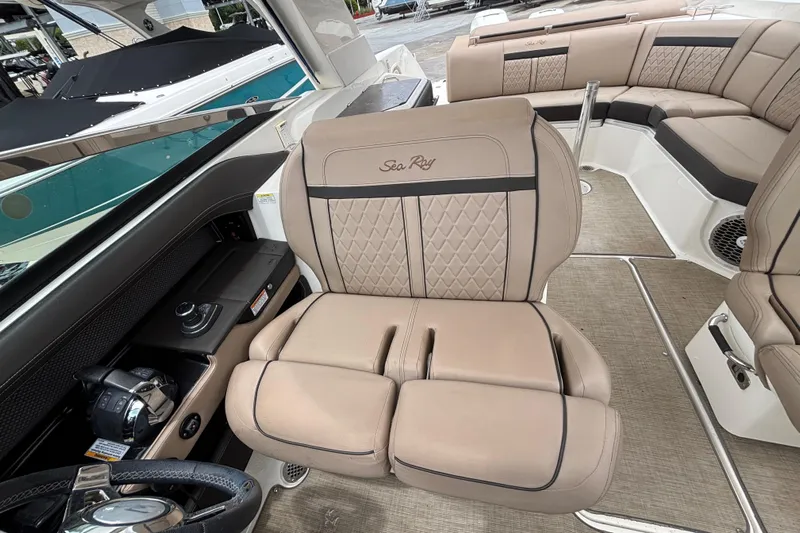  Yacht Photos Pics 2018 Sea Ray SLX 310 Outboard interior with luxurious beige seating and modern controls.