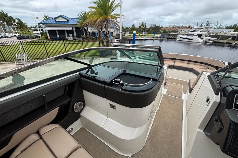  Yacht Photos Pics 2018 Sea Ray SLX 310 Outboard boat interior with seating and waterfront view.
