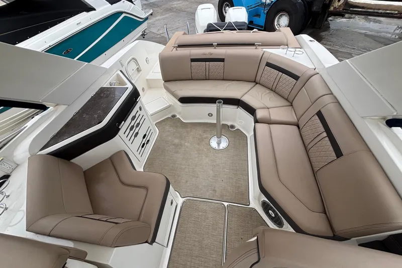  Yacht Photos Pics 2018 Sea Ray SLX 310 Outboard interior with beige seating and modern design.