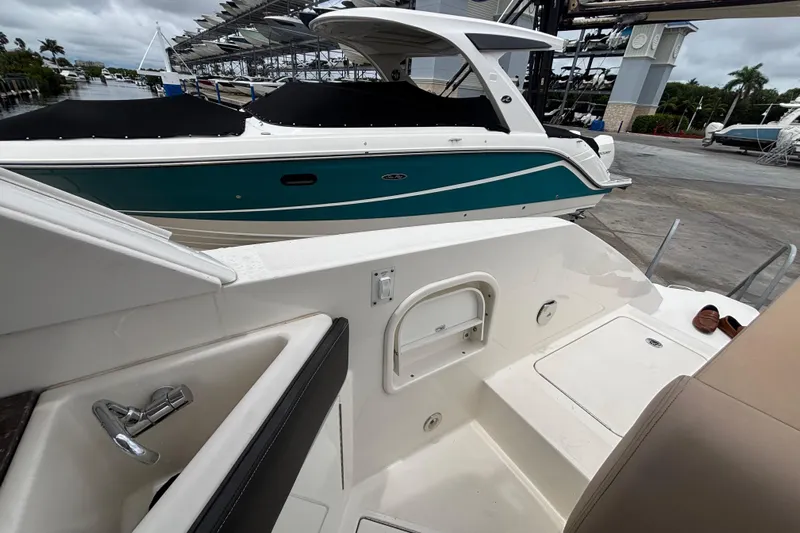  Yacht Photos Pics 2018 Sea Ray SLX 310 Outboard boat docked, featuring sleek design and spacious deck.