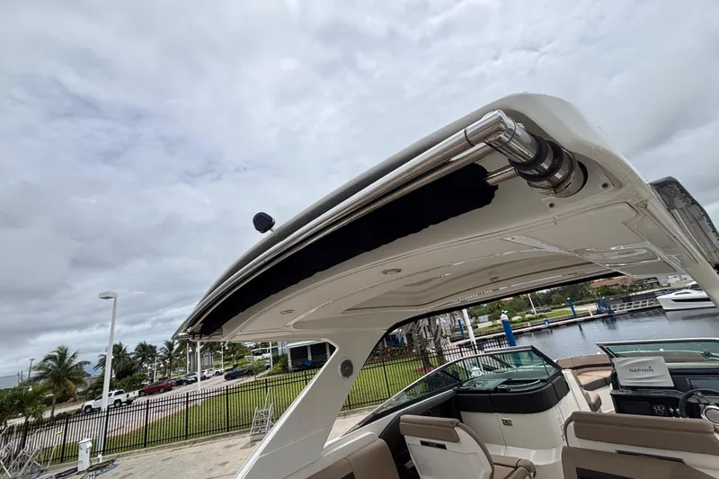  Yacht Photos Pics 2018 Sea Ray SLX 310 Outboard boat with sleek design, docked near a marina.