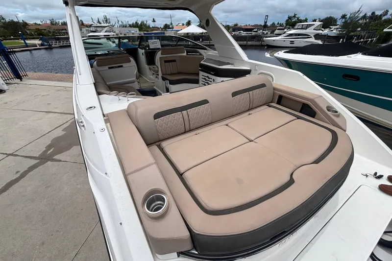  Yacht Photos Pics 2018 Sea Ray SLX 310 Outboard with spacious seating, docked at a marina.