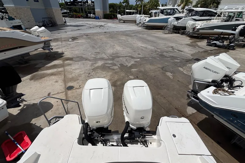  Yacht Photos Pics 2018 Sea Ray SLX 310 Outboard in a marina with other boats.