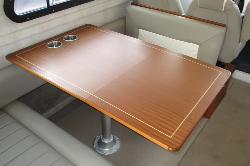  Yacht Photos Pics Luxurious interior of 2023 KingFisher 3225 GFX Offshore boat with elegant wooden table.