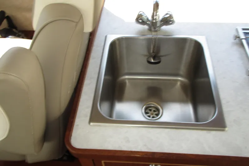  Yacht Photos Pics Stainless steel sink in 2023 KingFisher 3225 GFX Offshore boat interior.