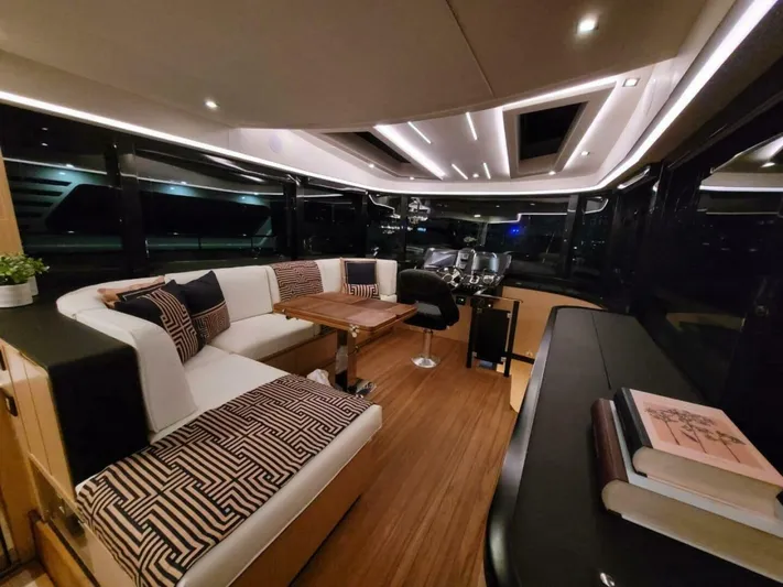  Yacht Photos Pics Luxurious interior of 2025 OKEAN 52 yacht with modern seating and elegant decor.
