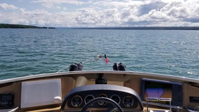 Makin Memories Yacht Photos Pics 2003 Carver 396 yacht dashboard with open water view and American flag.