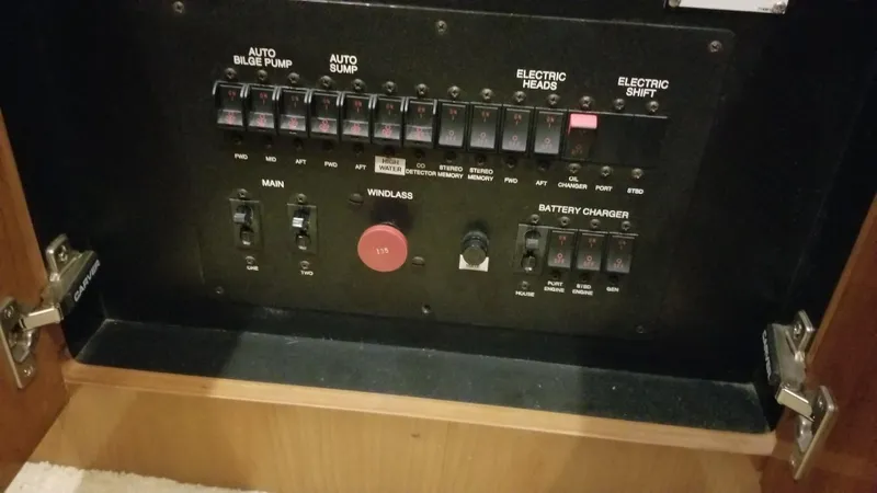 Makin Memories Yacht Photos Pics Control panel of a 2003 Carver 396 yacht, featuring switches and indicators.