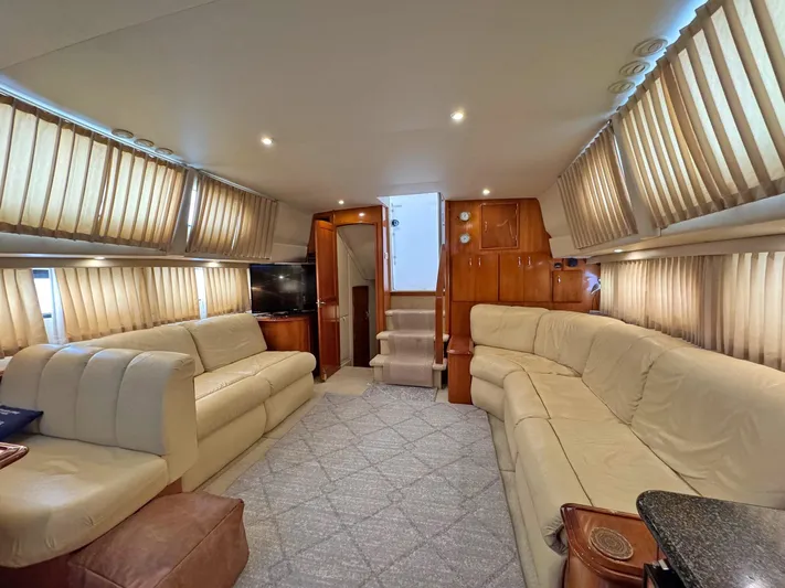 Makin Memories Yacht Photos Pics Luxurious interior of a 2003 Carver 396 yacht with plush seating and elegant wood finishes.