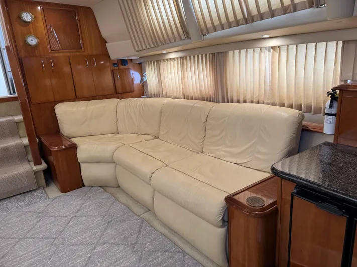 Makin Memories Yacht Photos Pics Luxurious interior of a 2003 Carver 396 yacht with beige leather seating.