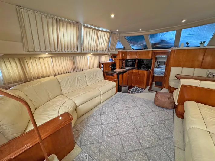 Makin Memories Yacht Photos Pics Luxurious interior of a 2003 Carver 396 yacht with plush seating and modern amenities.