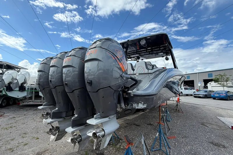  Yacht Photos Pics 2019 Midnight Express 43 Open boat with multiple outboard engines on display.