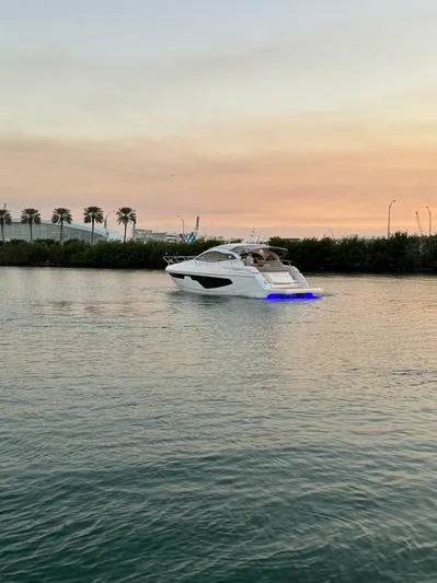  Yacht Photos Pics 2024 Sessa Marine C44 Cruiser on tranquil water at sunset.