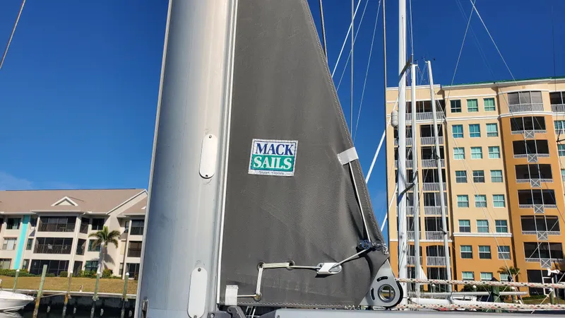  Yacht Photos Pics Sailboat with Mack Sails, Beneteau Oceanis 44 CC, 1999, docked near waterfront buildings.