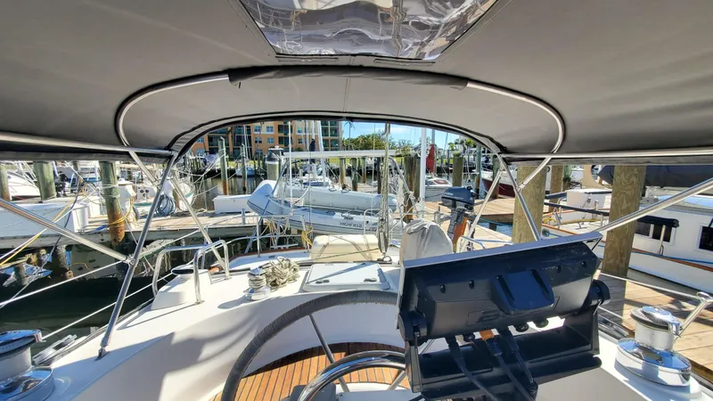  Yacht Photos Pics Cockpit view of 1999 Beneteau Oceanis 44 CC sailboat docked at marina.