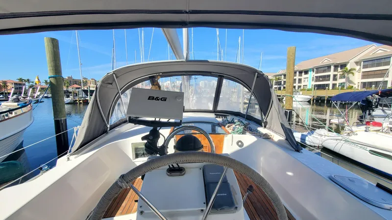  Yacht Photos Pics Cockpit view of 1999 Beneteau Oceanis 44 CC sailboat docked at marina.