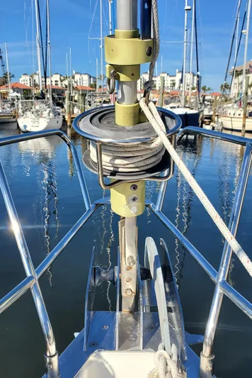  Yacht Photos Pics Beneteau Oceanis 44 CC sailboat bow with rigging, docked in a marina, 1999 model.