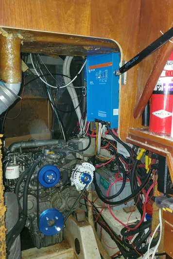  Yacht Photos Pics Engine room of 1999 Beneteau Oceanis 44 CC sailboat, showing engine and electrical components.